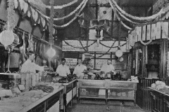 Hormel Provision Market in 1893. Herman Hormel was the manager, he is at the far right in the picture.