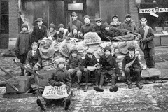 Williams Cigars and News with newspaper carriers in front of it - 1921