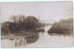 looking south on the Cedar River (likely 1937) at what today is the 2nd Ave NE bridge near Riverside Arena, just downstream from the dam