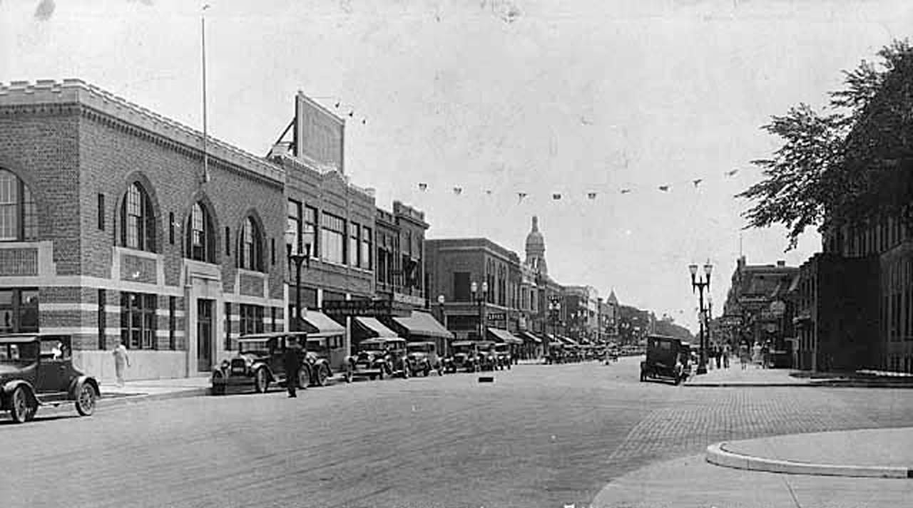 Main Street, looking south from where 1st Drive intersects. Lots of things you don't see anymore, like Model T's and the Shaw Gym for Boys Austin, Mn